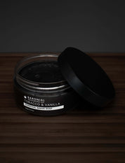 Tobacco & Vanilla Charcoal Shave Soap – artisan shave soap with rich lather and bold scent on dark rustic background.